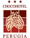 Logo con foglia e cacao su sfondo a quadri rossi.